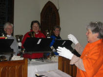 Louanne LeBourveau directing a rehearsal of the First Presbyterian